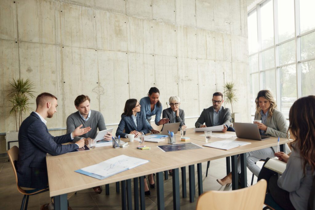 Business meeting with professionals around table.